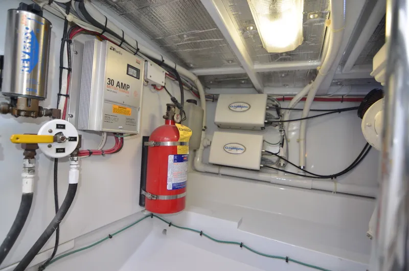 Slide: The Image of Interior of a 1993 Gamefisherman Open boat with electrical components. - 22