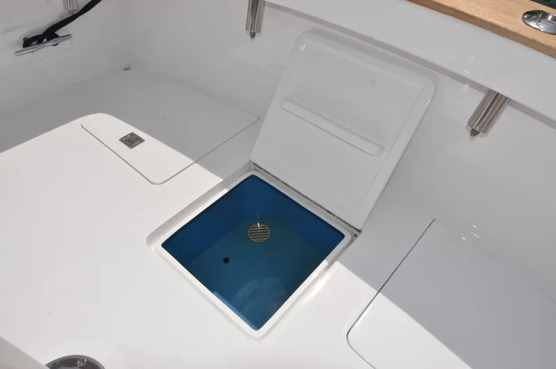 Slide: The Image of Open compartment on a 1993 Gamefisherman boat. - 28