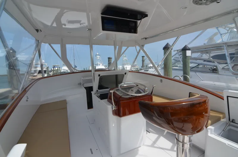 Slide: The Image of Interior view of a 1993 Gamefisherman Open boat at the dock. - 29