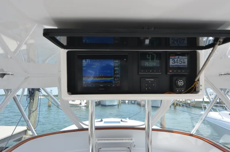 Slide: The Image of Dashboard of a 1993 Gamefisherman Open boat with navigation system. - 34