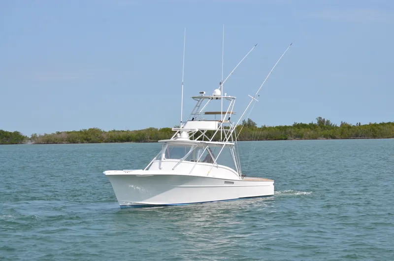 Slide: The Image of 1993 Gamefisherman Open boat on calm waters. - 4