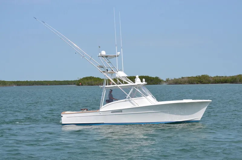 Slide: The Image of 1993 Gamefisherman Open boat on calm waters. - 5