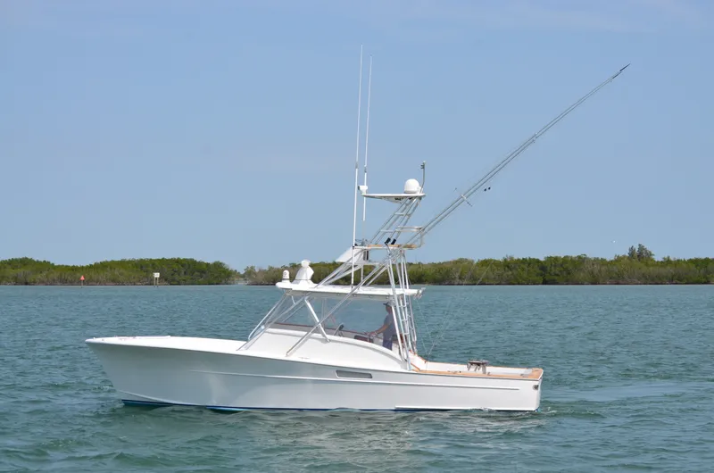 Slide: The Image of 1993 Gamefisherman Open boat on calm water. - 6