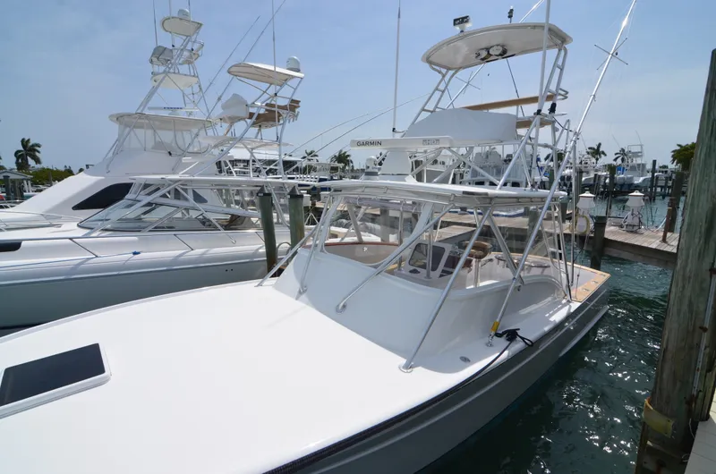 Slide: The Image of 1993 Gamefisherman Open boat docked at marina. - 7