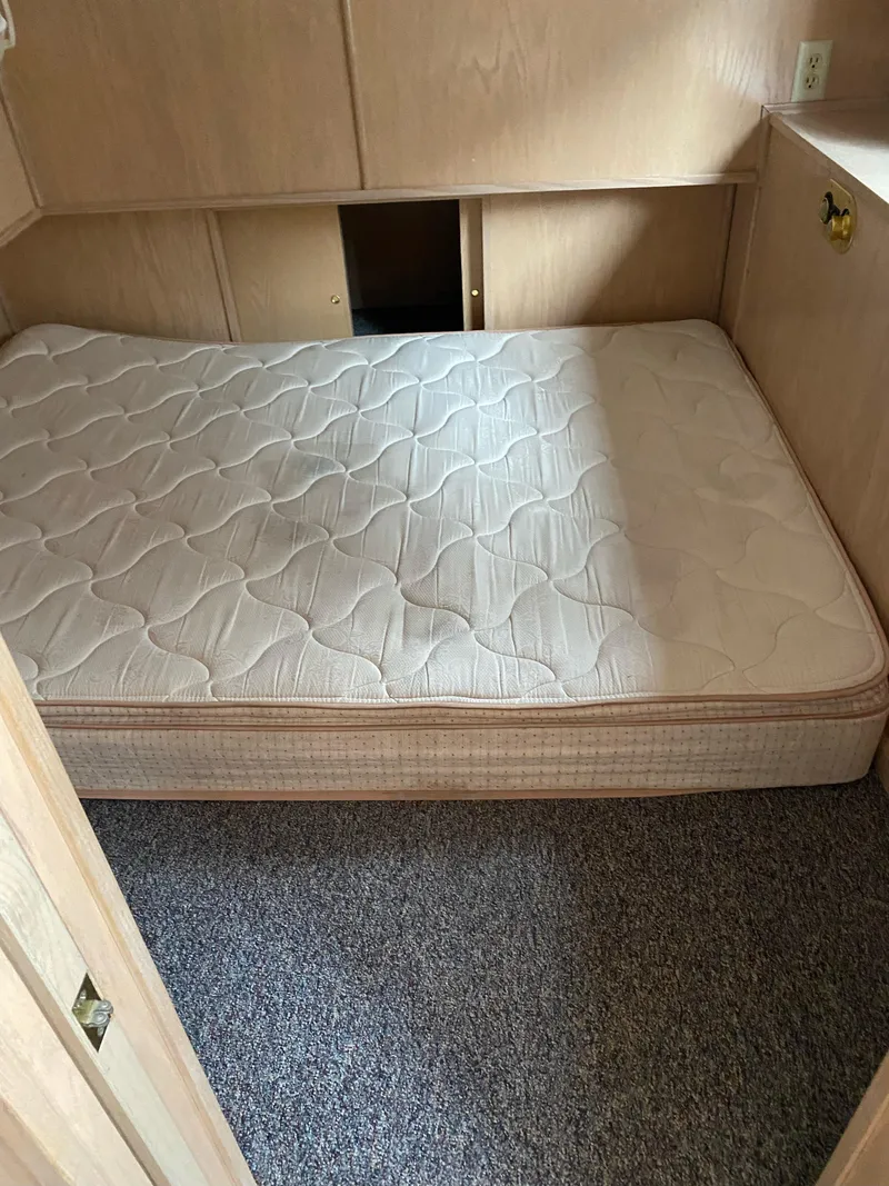 Slide: The Image of 2001 Stardust Cruisers Summer Dreamin' cabin with mattress, beige walls, and carpeted floor. - 10