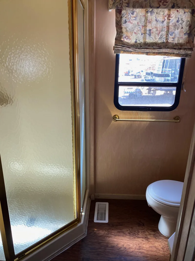 Slide: The Image of Bathroom interior of 2001 Stardust Cruisers Summer Dreamin', featuring shower and window. - 13
