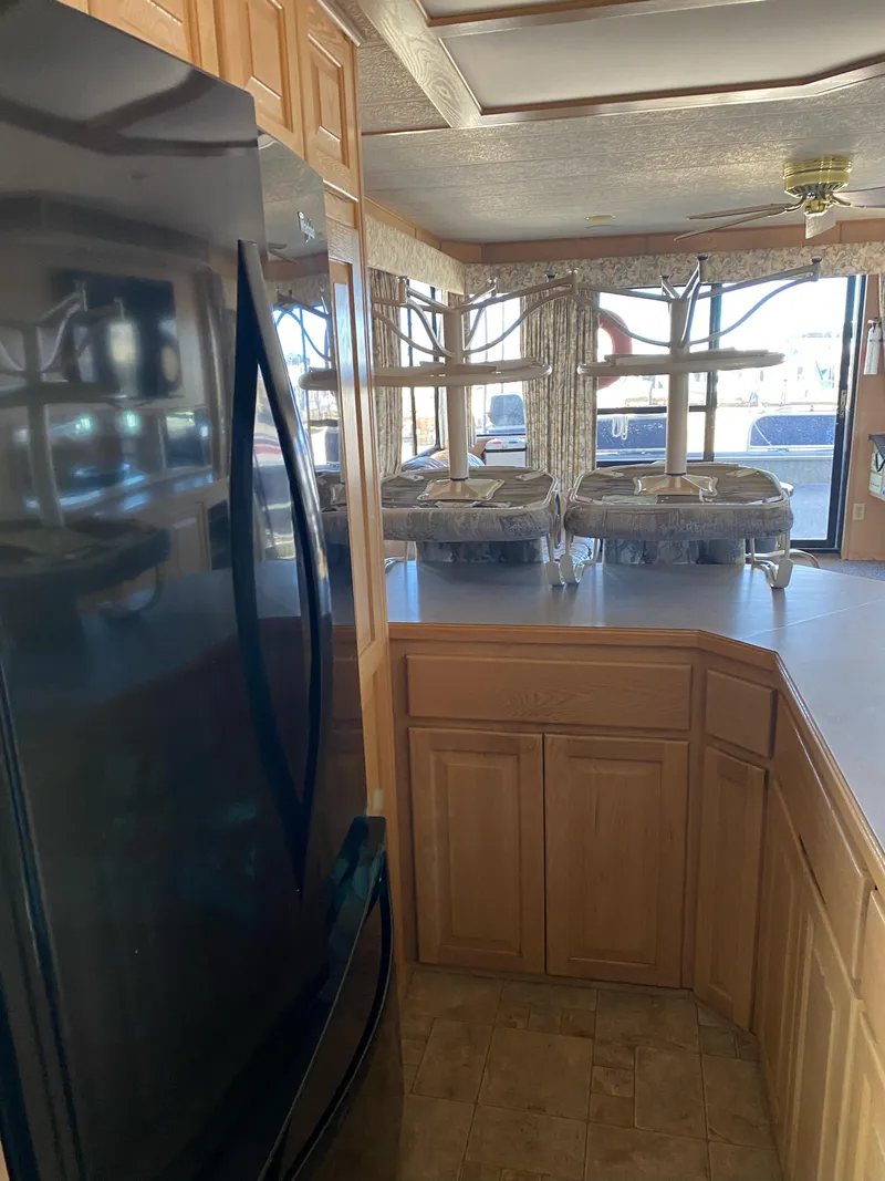 Slide: The Image of Interior of 2001 Stardust Cruisers Summer Dreamin' Trip, featuring kitchen cabinets and large windows. - 19