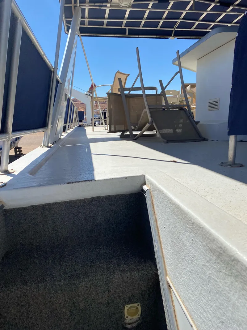 Slide: The Image of 2001 Stardust Cruisers Summer Dreamin' Trip 37 and 38 boat deck with chairs and canopy. - 32