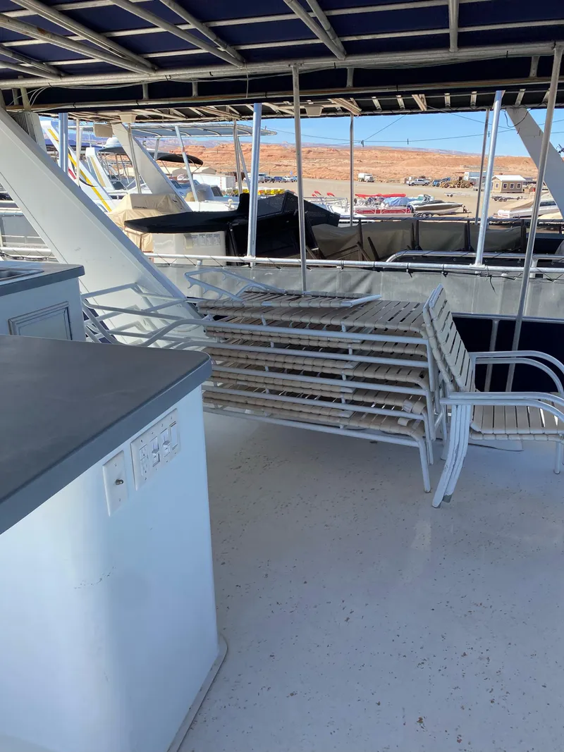 Slide: The Image of 2001 Stardust Cruisers Summer Dreamin' Trip 37 and 38 boat interior with seating and railing. - 34