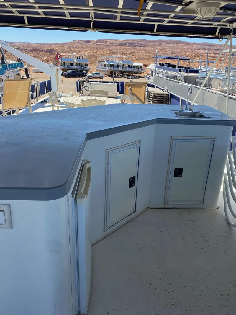 Slide: The Image of 2001 Stardust Cruisers Summer Dreamin' Trip 37 and 38 boat deck with seating and storage. - 35