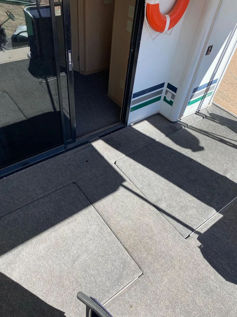 Slide: The Image of 2001 Stardust Cruisers Summer Dreamin' Trip deck with life preserver and sliding glass door. - 41