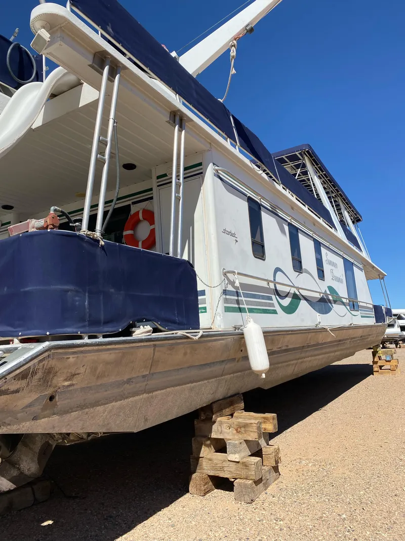 Slide: The Image of 2001 Stardust Cruisers Summer Dreamin' Trip 37 and 38 houseboat on dry dock. - 47