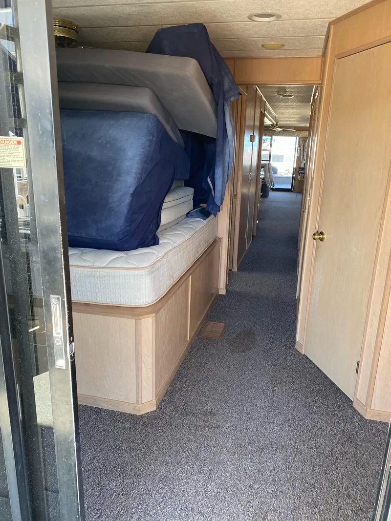 Slide: The Image of Interior hallway of 2001 Stardust Cruisers Summer Dreamin' Trip, featuring stacked mattresses. - 5