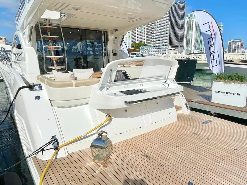 Slide: The Image of Luxury Schaefer 510 GT yacht docked, showcasing modern design and amenities, 2025 model. - 10