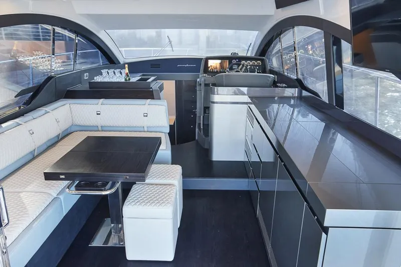 Slide: The Image of Luxurious interior of 2025 Schaefer 510 GT yacht with modern seating and sleek design. - 13