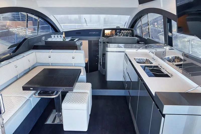 Slide: The Image of Luxurious interior of 2025 Schaefer 510 GT yacht with modern kitchen and seating area. - 14
