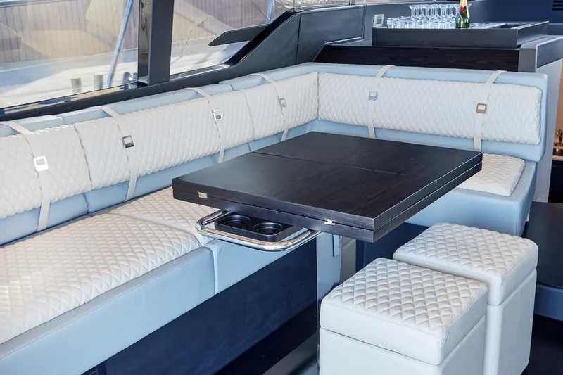 Slide: The Image of Luxurious interior of 2025 Schaefer 510 GT yacht with elegant seating and table. - 15
