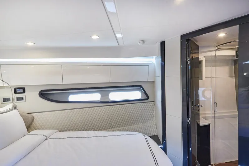 Slide: The Image of Luxurious interior of 2025 Schaefer 510 GT yacht with modern bedroom and ensuite bathroom. - 22