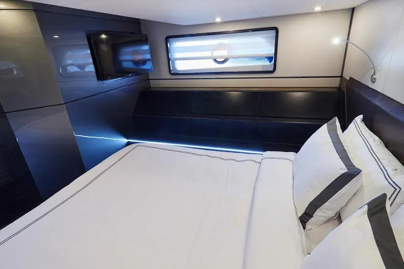 Slide: The Image of Luxurious cabin interior of 2025 Schaefer 510 GT yacht with modern design and cozy bedding. - 25