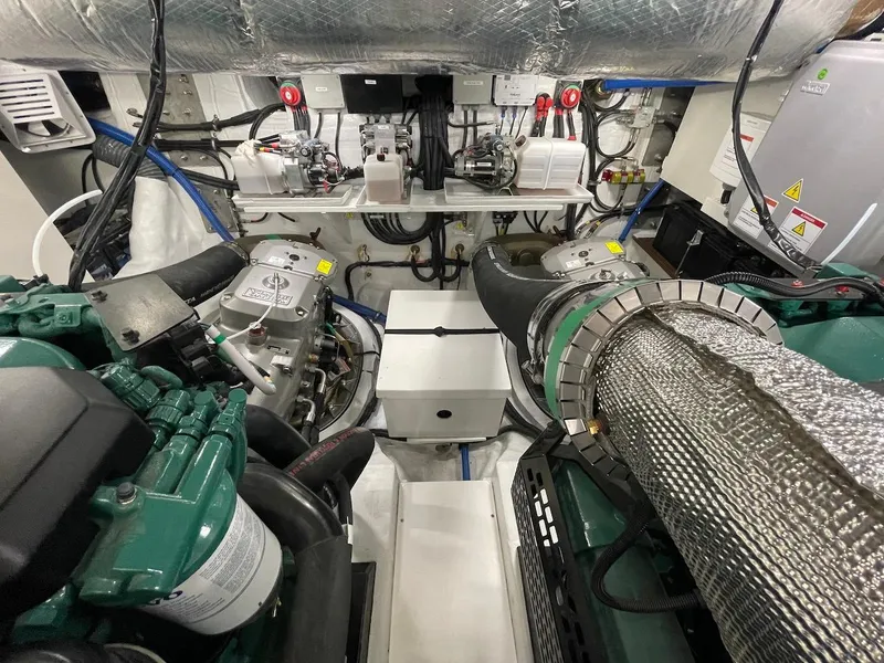Slide: The Image of Engine room of a 2025 Schaefer 510 GT yacht, showcasing mechanical components and wiring. - 44