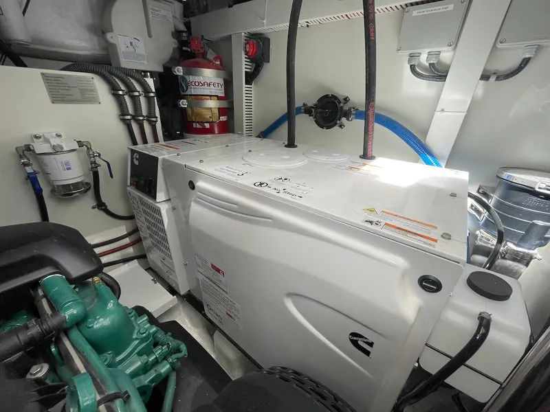Slide: The Image of Engine room of 2025 Schaefer 510 GT yacht with Cummins generator and safety equipment. - 45