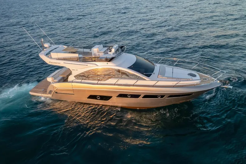 Slide: The Image of 2025 Schaefer 510 GT yacht cruising on open water, side view. - 6