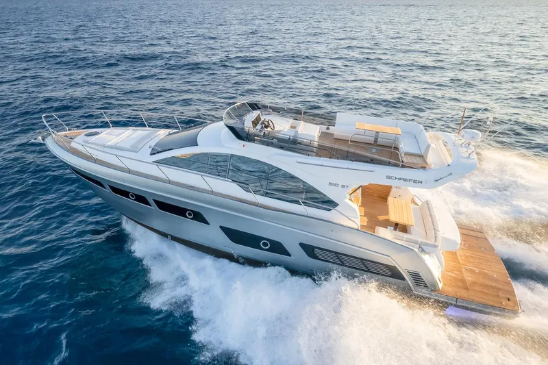 Slide: The Image of 2025 Schaefer 510 GT yacht cruising on open sea, showcasing sleek design and luxury features. - 8