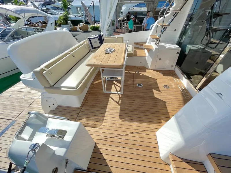Slide: The Image of Luxurious 2025 Schaefer 510 GT yacht deck with seating and table. - 12