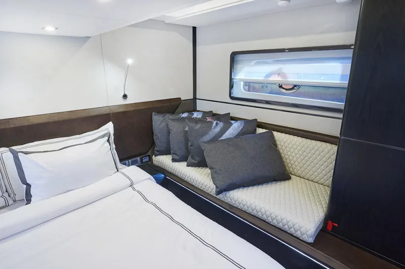 Slide: The Image of Luxurious cabin interior of 2025 Schaefer 510 GT yacht with elegant bedding and seating. - 26