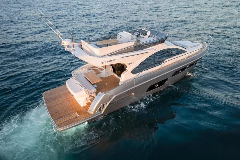 Slide: The Image of 2025 Schaefer 510 GT yacht cruising on open water, showcasing sleek design and luxury features. - 5