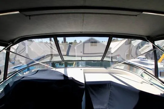 Slide: The Image of 2002 Bayliner 3988 Command Bridge Motoryacht interior view with marina backdrop. - 13