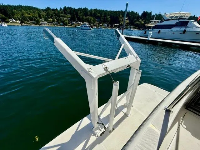 Slide: The Image of 2002 Bayliner 3988 Command Bridge Motoryacht with davit system on a sunny marina. - 19