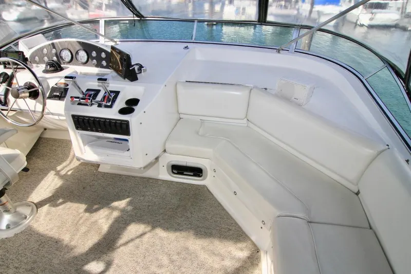 Slide: The Image of 2002 Bayliner 3988 Command Bridge Motoryacht interior with helm and seating area. - 27