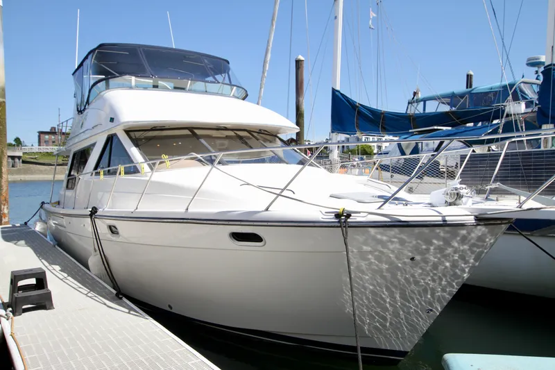 Slide: The Image of 2002 Bayliner 3988 Command Bridge Motoryacht docked at marina. - 3