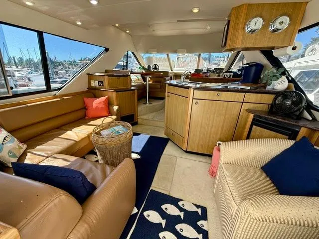 Slide: The Image of Luxurious interior of 2002 Bayliner 3988 Command Bridge Motoryacht with plush seating and modern amenities. - 32