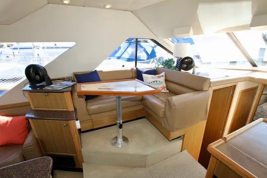 Slide: The Image of 2002 Bayliner 3988 Command Bridge Motoryacht interior with cozy seating and table. - 41
