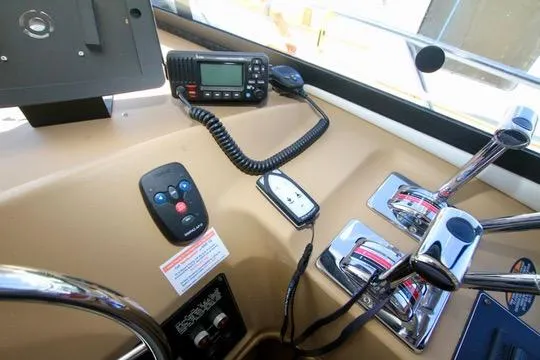 Slide: The Image of Control panel of 2002 Bayliner 3988 Command Bridge Motoryacht with radio and throttle levers. - 47