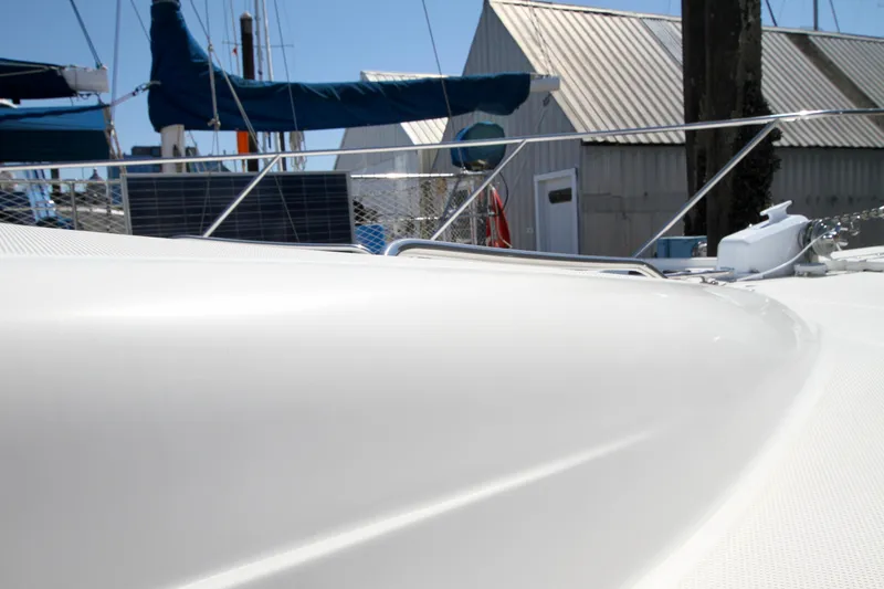 Slide: The Image of 2002 Bayliner 3988 Command Bridge Motoryacht deck with marina background. - 7