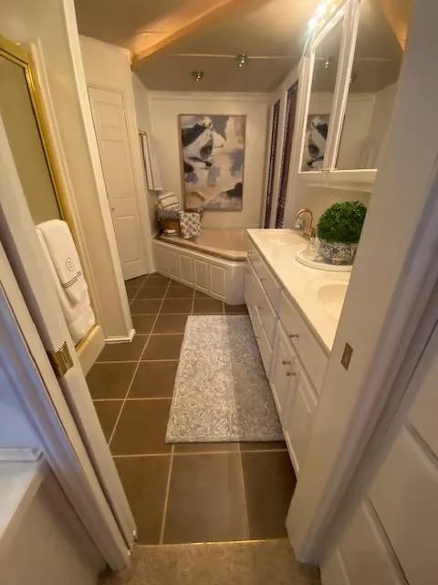 Slide: The Image of Luxurious houseboat bathroom with modern decor, featuring a bathtub, vanity, and elegant lighting. - 17