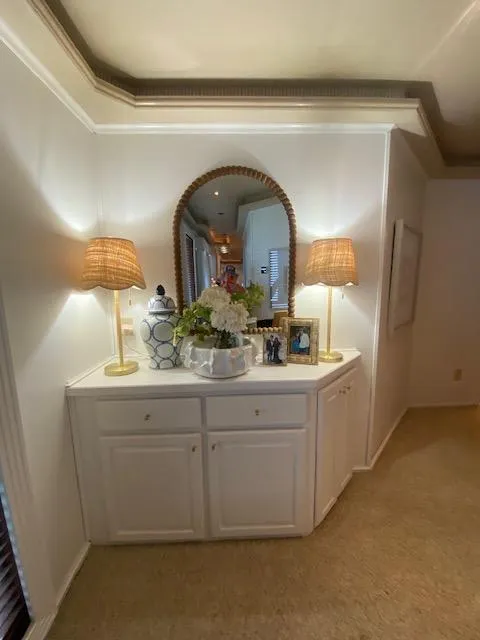 Slide: The Image of Elegant hallway with white cabinet, decorative lamps, and a mirror on a Fantasy Houseboat. - 22