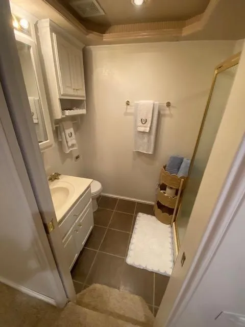 Slide: The Image of Compact bathroom in a 2006 Fantasy houseboat with modern fixtures and elegant decor. - 24