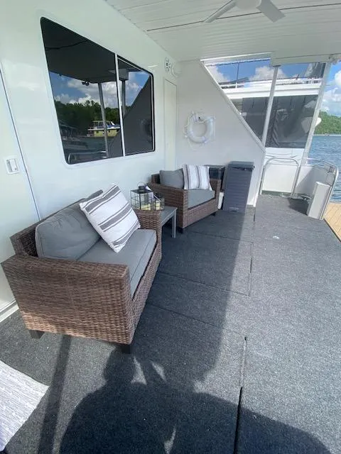 Slide: The Image of Houseboat deck with wicker chairs, cushions, and lake view, Fantasy model, 2006. - 31