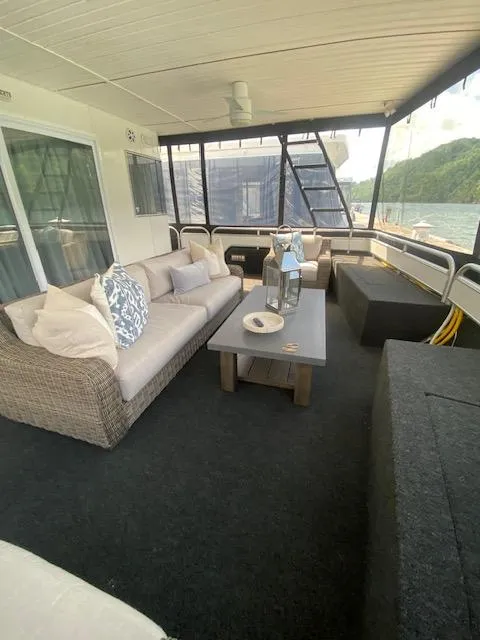 Slide: The Image of Spacious 2006 Fantasy houseboat deck with cozy seating and scenic water views. - 32