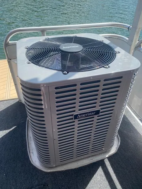 Slide: The Image of Air conditioning unit on a 2006 Fantasy houseboat deck by the water. - 42