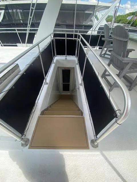 Slide: The Image of Staircase leading below deck on a 2006 Fantasy Houseboat. - 47