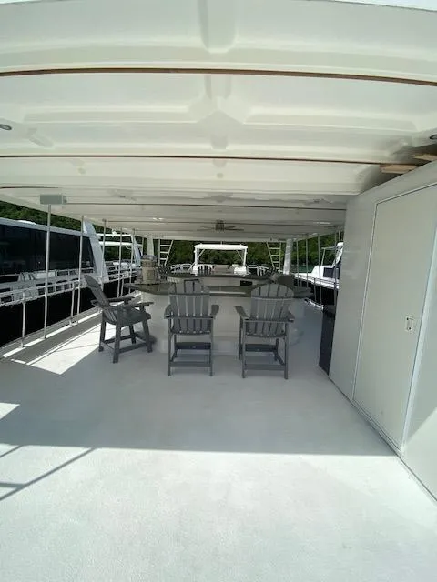 Slide: The Image of Spacious deck of a 2006 Fantasy houseboat with seating and scenic views. - 49