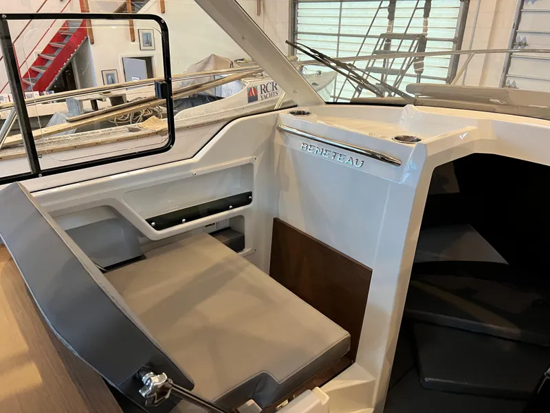 Slide: The Image of 2023 Beneteau Antares 8 interior cabin with seating and helm station. - 22