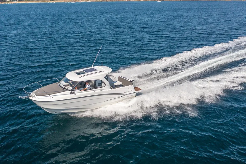 Slide: The Image of 2023 Beneteau Antares 8 cruising on open water, showcasing sleek design and performance. - 6