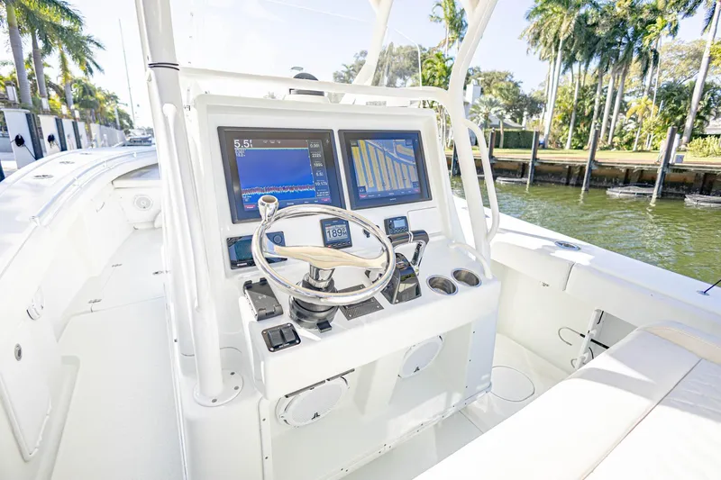 Slide: The Image of 2015 Yellowfin 32 Offshore boat cockpit with advanced navigation displays. - 13