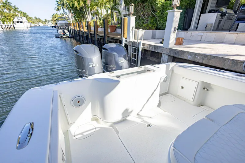 Slide: The Image of 2015 Yellowfin 32 Offshore boat with dual Yamaha 300 engines docked by waterfront. - 30